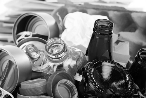 Vans and operatives ready for house clearance on a Forest Gate street